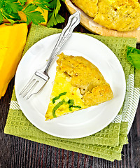 Image showing Pie of pumpkin and cheese in plate on board top