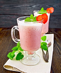 Image showing Soup strawberry in goblet on dark board