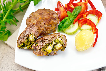 Image showing Cutlets stuffed in plate on granite table