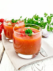 Image showing Soup tomato in two glasses with parsley on board