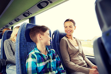 Image showing happy family riding in travel bus