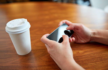 Image showing close up of woman with smartphone and coffee