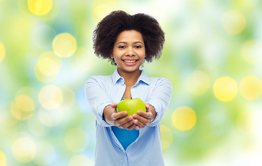 Image showing happy african american woman with green apple