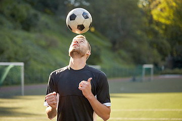 Image showing soccer player playing with ball on field