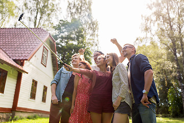 Image showing friends taking selfie at party in summer garden