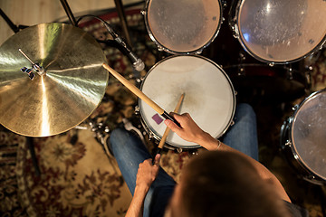 Image showing male musician playing drums and cymbals at concert