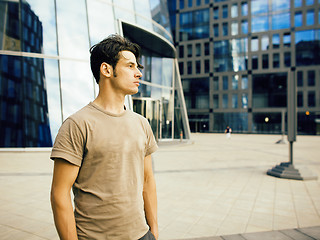 Image showing young handsome man near business building, modern businessman concept