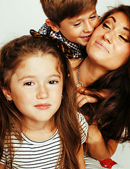 Image showing young mother with two children on white, happy smiling family in