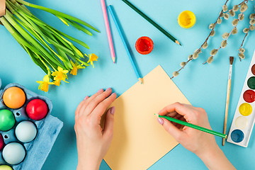 Image showing The top view of easter on blue table office workplace