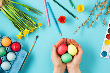 Image showing The top view of easter on blue table office workplace