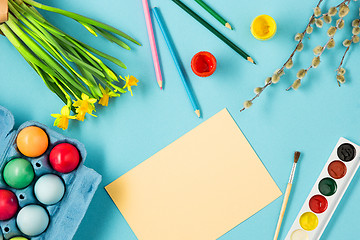 Image showing The top view of easter on blue table office workplace