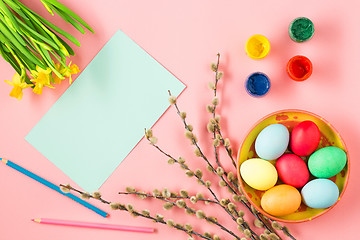 Image showing The top view of easter on pink table office workplace