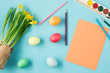 Image showing The top view of easter on blue table office workplace