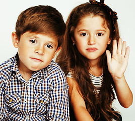 Image showing little cute boy and girl hugging playing on white background, ha