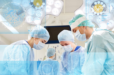 Image showing group of surgeons in operating room at hospital