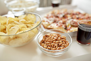 Image showing close up of fast food snacks and drink on table