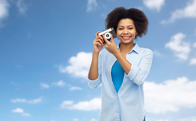 Image showing happy african american woman with film camera