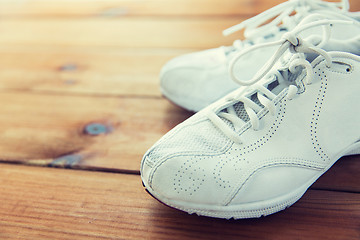 Image showing close up of sneakers on wooden floor