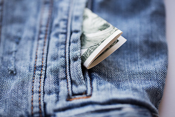 Image showing dollar money in pocket of denim jacket