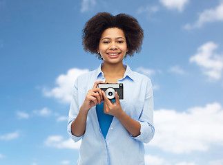 Image showing happy african american woman with film camera