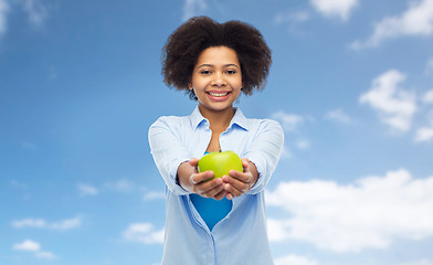 Image showing happy african american woman with green apple