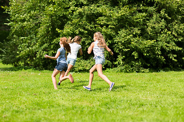 Image showing group of happy kids or friends playing outdoors