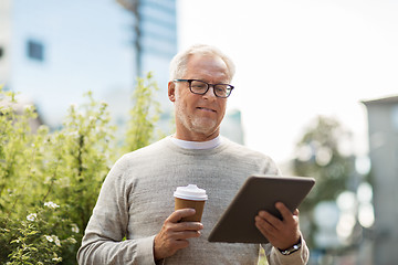 Image showing senior man with tablet pc and coffee in city