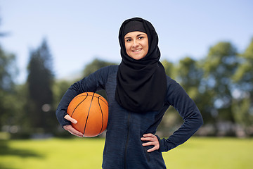 Image showing happy muslim woman in hijab with basketball