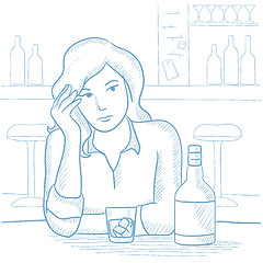 Image showing Woman drinking alcoholic drink at the bar.