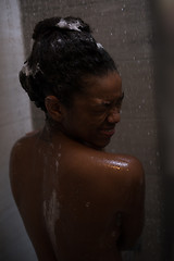 Image showing African American woman in the shower