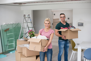 Image showing young couple moving into a new home