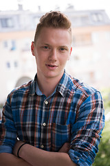 Image showing man standing at balcony