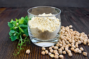 Image showing Flour chickpeas in glassful with peas on board