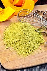 Image showing Flour pumpkin with mixer and vegetable on board