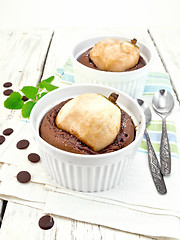 Image showing Cake chocolate with pear in white bowl on kitchen towel