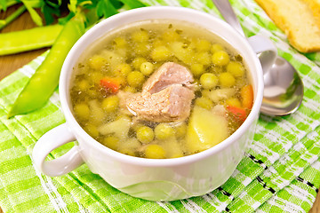 Image showing Soup from green peas with meat on napkin