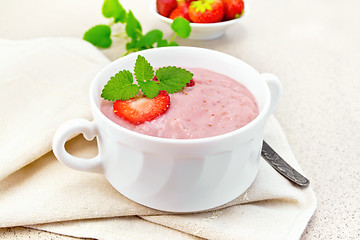 Image showing Soup strawberry in white bowl on granite table