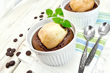 Image showing Cake chocolate with pear and mint in white bowl on napkin