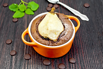 Image showing Cake with chocolate and pear in red bowl on board