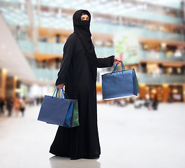 Image showing muslim woman in hijab with shopping bags