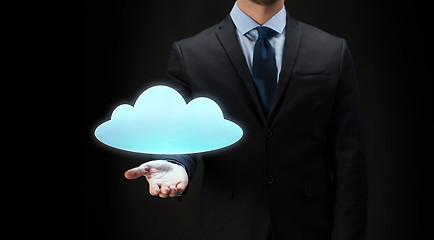 Image showing close up of businessman with cloud projection