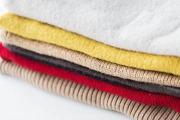 Image showing close up of stacked knitted clothes