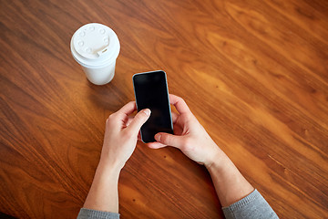 Image showing close up of woman with smartphone and coffee 