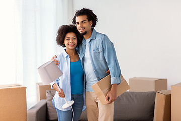 Image showing happy couple with stuff moving to new home