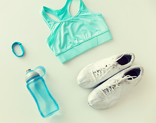 Image showing close up of sportswear, bracelet and bottle