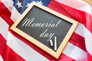 Image showing memorial day words on chalkboard and american flag