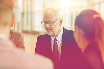 Image showing smiling business people meeting in office