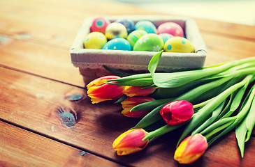 Image showing close up of colored easter eggs and flowers