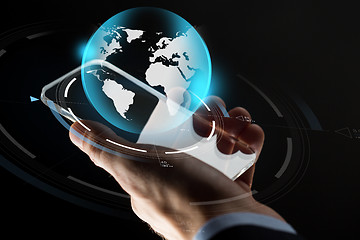 Image showing businessman hand with smartphone and earth