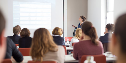 Image showing Woman giving presentation in lecture hall at university.